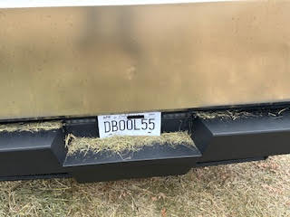 Hay residue on the tailgate of a Tesla Cybertruck.
