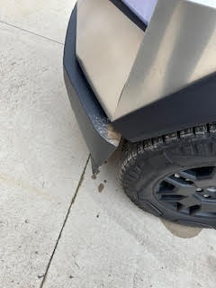 Dirt on the side of a Tesla Cybertruck.