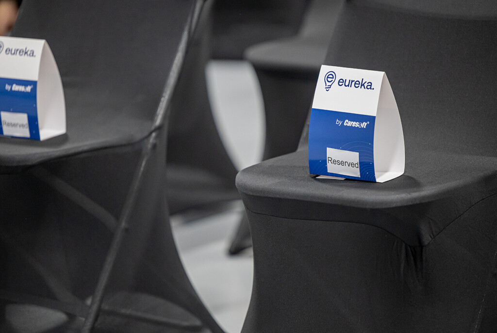 An image of a Eureka printed 'Reserved' sign on top of a conference chair.
